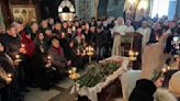 Putin foe Alexei Navalny is buried in Moscow as thousands attend under heavy police presence