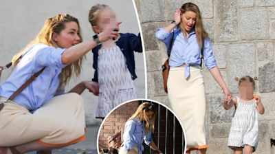 Smiling Amber Heard enjoys a sunny stroll with 3-year-old daughter Oonagh Paige in Spain