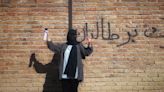 'All Or No One': In Afghanistan, A Woman Is Painting Walls To Protest University Ban