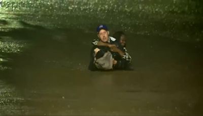 Moment weather reporter rescues woman from Hurricane Helene floods during live report