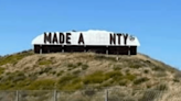 Where are the missing letters on Madera County’s sign?