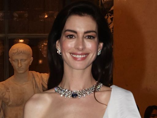 Can you believe Anne Hathaway’s sheer white corset shirt dress is from GAP?