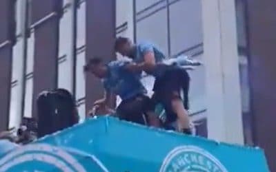 Jack Grealish almost falls off Manchester City’s open-top bus parade twice