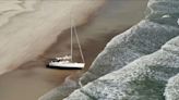 Marooned sailboat creates a sight for beachgoers at Anastasia State Park