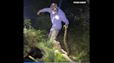 10-foot python bites down on hunter’s boot and refuses to let go, Florida video shows