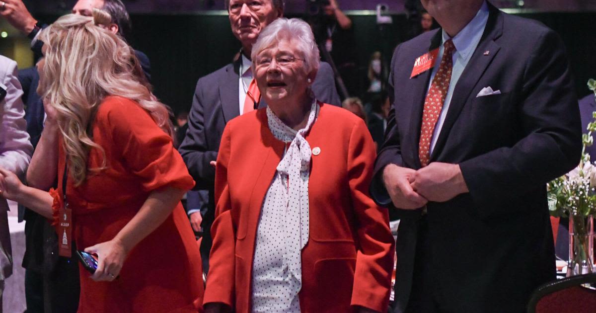 Kay Ivey listens to former President Donald Trump speak during the Alabama Republican Party’ s Summer meeting at the Renaissance Montgomery Hotel on Aug...