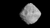 Cometary Dust Smashed Tiny Craters into the Surface of Asteroid Ryugu