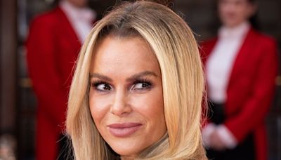 Amanda Holden looks straight out of Baywatch in eye-catching swimsuit