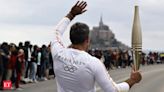 France's Bastille Day parade meets the Olympic torch relay in an exceptional year - The Economic Times