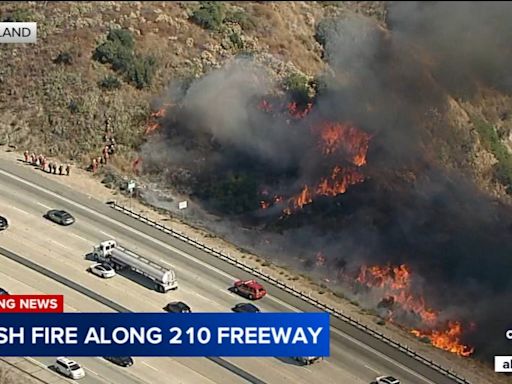 Crews get upper hand on fast-moving brush fire burning along eastbound 210 Freeway in Sunland