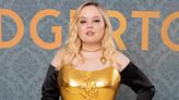“Bridgerton”'s Nicola Coughlan Wears 22-Karat Golden Corset Featuring Fun Homage to Her Character at London Premiere