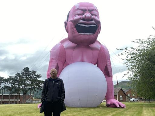 Giant pink man causes stir in small Welsh town