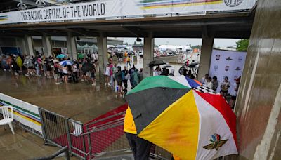 Indy 500 is delayed HOURS by thunderstorms as fans race each other