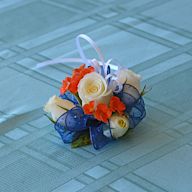 Corsages worn on the wrist. Typically made from flowers and ribbons. Popular for proms, weddings, and other formal events.