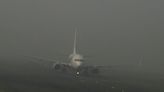 Passengers stuck on planes for 12 hours as fog causes travel chaos in India