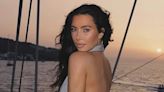Kim Kardashian poses in a backless top during 'sunset sail' on yacht