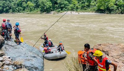 Rescuers in Nepal resume search for 66 still missing after landslide sweeps buses into river