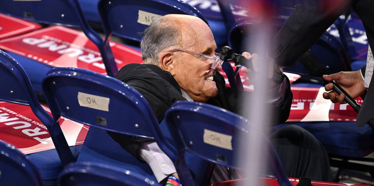 Rudy Giuliani Crashes Into Empty Chairs After Bizarre Fall At RNC