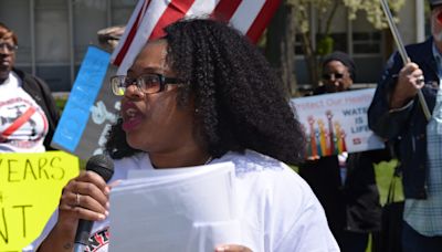 Dozens march to Flint city hall as the water crisis turns 10 year old