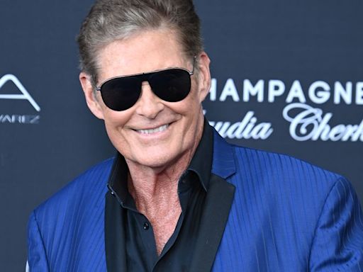 Baywatch legend David Hasselhoff proudly reveals he's a grandad as he emotionally cradles newborn