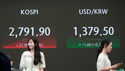Stock market today: Asian stocks are mixed after Wall Street edges to more records