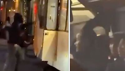 Moment passengers hide at front of bus being attacked by thugs in horror riots