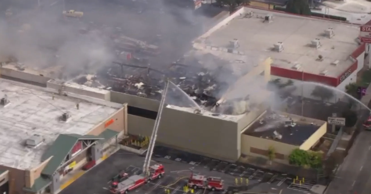 Firefight continues as "stubborn" fire burns at vacant building near West LA