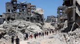 Bodies trapped in Gaza City under Israeli assault as mediators seek truce