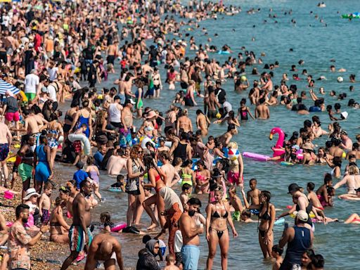 Families enjoy day out at jam-packed beaches on hottest day of 2024