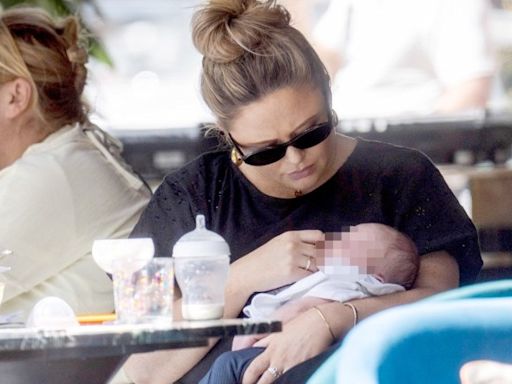 Emily Atack dotes on newborn son in first sighting since giving birth