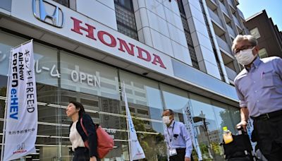 Honda posts record profit, issues cautious forecasts