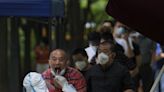 China reduces quarantine period for overseas arrivals