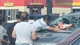 Video captures father smashing windshield to rescue baby from hot car