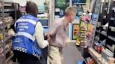 Moment beer thief loses coat after being wrestled by M&S guard