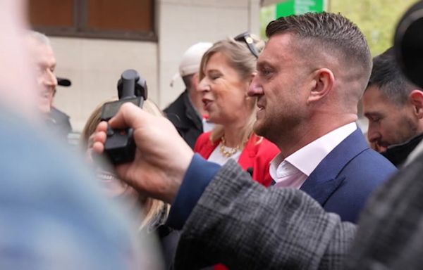 Tommy Robinson arrives at court accompanied by Katie Hopkins