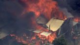 A wildfire in Australia on the outskirts of Perth destroys at least 2 homes and injures 2 people