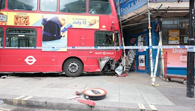 Six people injured as double-decker bus smashes into shop scaffolding