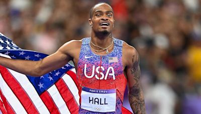 Quincy Hall's brother barks like a dog while reacting to 400m gold