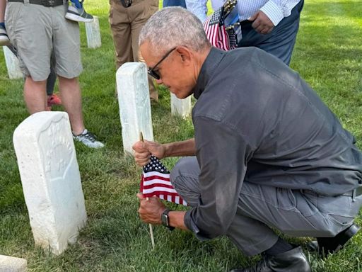 Former President Barack Obama makes surprise appearance at Alexandria National Cemetery