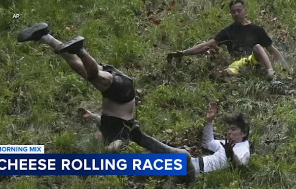 Dozens roll down Cooper's Hill in annual cheese-chasing race in England