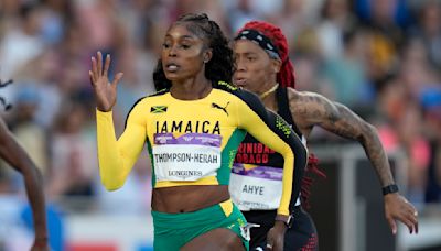 Injured Olympic champ Thompson-Herah of Jamaica will miss chance at 3rd straight title in 100, 200