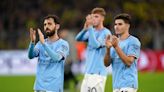 Pep Guardiola satisfied as tired Man City wrap up top spot with draw in Dortmund