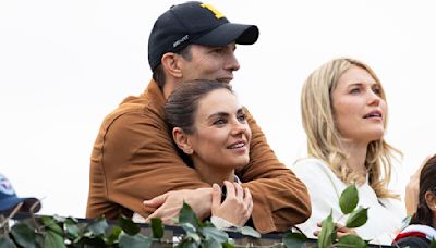 Ashton Kutcher and Mila Kunis pack on the PDA at Morgan Wallen gig