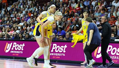 LA Sparks rookie Cameron Brink helped off the court after suffering knee injury