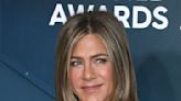 Jennifer Aniston Lounges in a Black & Pink Bikini Showing Off Her Golden Summer Glow