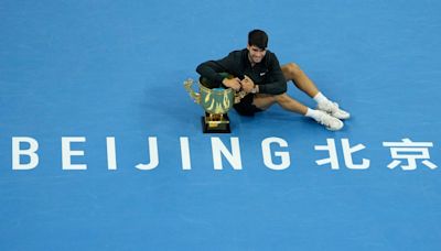 China Open: Carlos Alcaraz roars back from a set down to beat Jannik Sinner, win maiden title