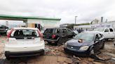 High winds from storm knock down trees, damage west Fort Worth strip mall, car dealership