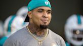 Mike Pouncey, 70 pounds lighter, honored by Dolphins, in turn honors VP Jason Jenkins