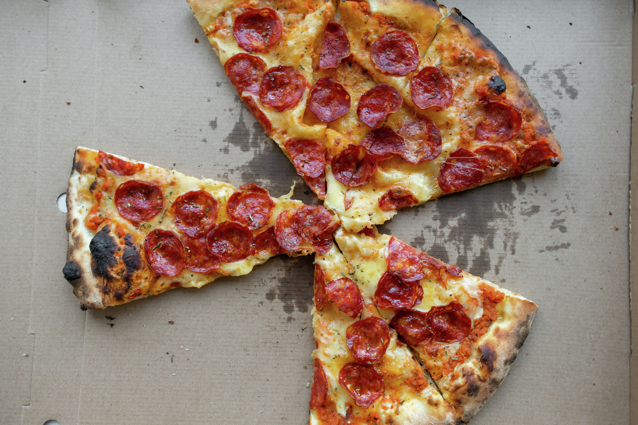 What is the best way to reheat leftover pizza?