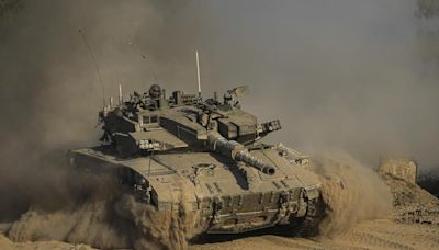 Israeli strikes across Gaza kill more than 30 as the sides weigh the latest cease-fire proposal